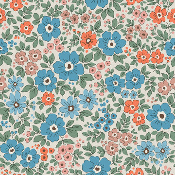 Vintage seamless floral pattern. Liberty style background of small blue and orange flowers. Small flowers scattered over a beige background. Stock vector printing for surfaces. Abstract flowers. 
