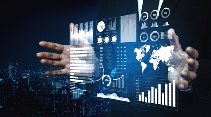 A businessman interacts with a digital data interface showcasing graphs and global metrics, set...