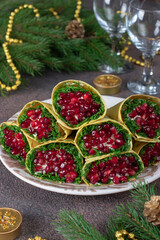 Appetizer from pita bread with crab sticks, corn and pomegranate