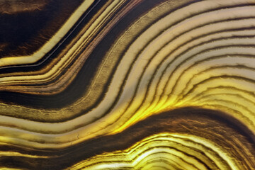 agate contrast yellow and brown lines closeup