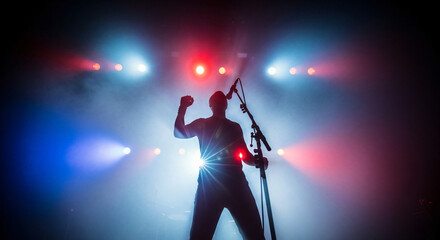 Energetic musician passionately performing on stage with dramatic lighting and smoke effects during a live concert