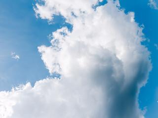 Bright blue sky with soft white clouds on a sunny day, perfect for nature, travel or relaxation...