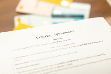 Obraz premium Loan agreement scissors and credit cards in close-up