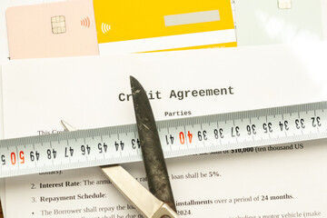 Loan agreement scissors and credit cards in close-up