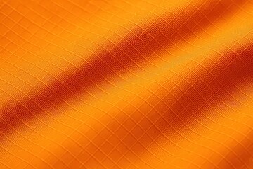 Macro of Orange Ripstop Fabric with Light Reflecting Along Clean Flat Lines
