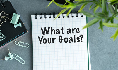 A notebook with the words What are your goals written on it