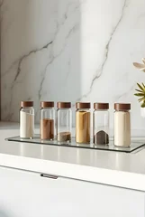 Glass stand mockup with kitchen bottles in clean modern setting, blank labels for spice or oil branding and product packaging © Anas