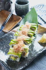 Avocado Soft Shell Crab Roll with Bonito Flakes in tray side view of Japanese Sushi Meal