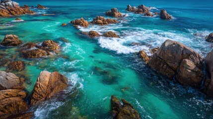 Abstract View of Turquoise Water Flowing Between Jagged Rocks in a Peaceful Coastal Landscape