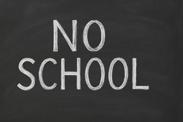 No school written on black chalkboard, education holiday concept, classroom closed notice, school vacation message, academic break announcement, learning pause symbol, educational institution closure 