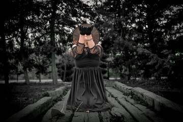 Witch performs ritual in the woods
