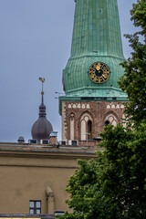 Clock Tower of St. James’s Cathedral and Dome Church in Riga, Latvia – Historic Churches in Old Town Skyline. 01.08.2025. Rīga. Latvia