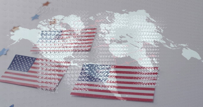 Naklejki Displaying American flag cards on tabletop with star confetti in red blue gold, world map overlay