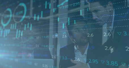 Collaborating three executives analyzing data around laptop in boardroom, with market data overlays