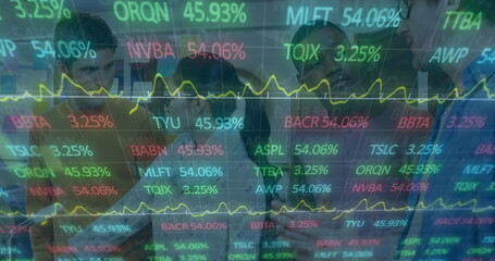 Analyzing six professionals examining digital display using tablet in office, with stock graphs