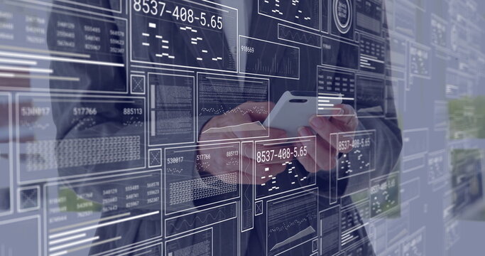 Tapping smartphone, woman in suit showing data panels in office corridor, with glass wall and plant