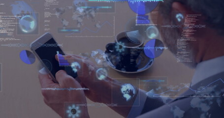 Studying businessman holding smartphone and viewing data charts at wooden table with coffee cup