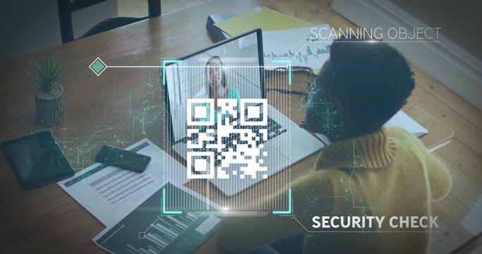 Scanning woman in mustard sweater performing security verification at office, with QR code overlay - Powered by Adobe