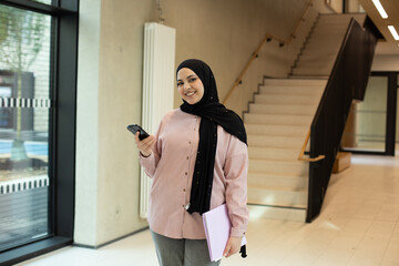 Muslim young student girl in university.