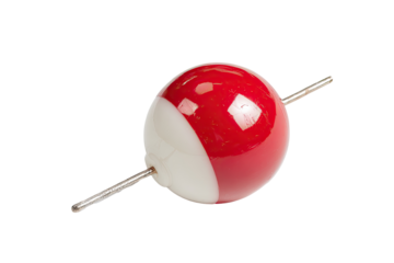 Close-up of a red and white sphere-shaped fishing float with a metal pin