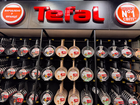 Tefal Frying Pans Retail Display with Nonstick Cookware Hanging on Store Shelves, Dnipro, Ukraine - June 20, 2025