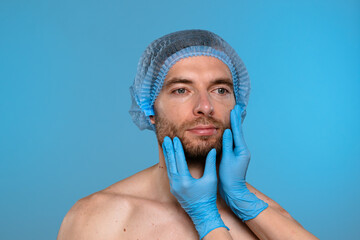 Esthetic assessment of a man's face by a cosmetologist