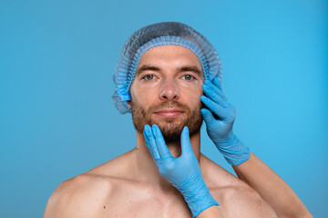 Esthetic assessment of a man's face by a cosmetologist
