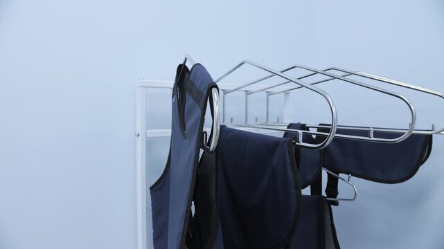 Lead aprons hanging on medical rack