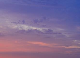Clouds in the sunset sky. Serene cloudscape background.