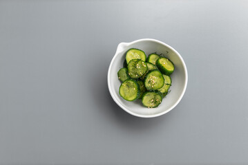 Fresh cucumber salad with dill and sesame seeds