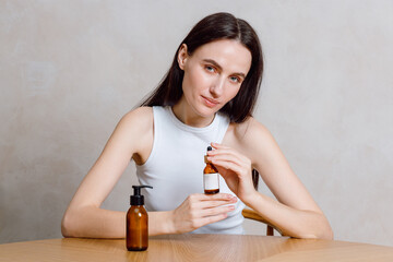 Young woman enjoys skincare routine at home with natural beauty products