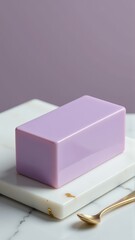 A beautiful lavender soap bar displayed on a marble tray, showcasing its smooth texture.