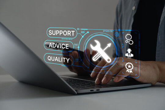 Technical support operator with virtual screen icon working on laptop computer. Help desk IT support call center online technology. Customer service and business warranty quality assurance concept.