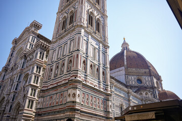 Fototapeta premium Close up of Florence Cathedral with Giotto bell tower and Brunelleschi dome on sunny day Italy