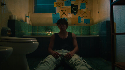 Lost And Depressed Man In The Bathroom Of His Apartment