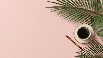 Flatlay of coffee cup, pen, and tropical leaves on a pale pink background, ample copy space