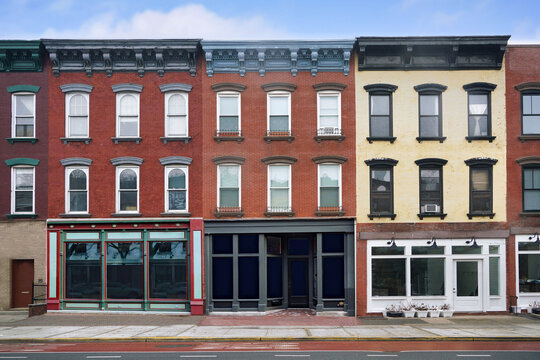 old three story main street buildings with stores on the ground floor and apartments above
