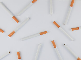 A stack of cigarettes on a white background. The concept of independence on smoking, unhealthy...