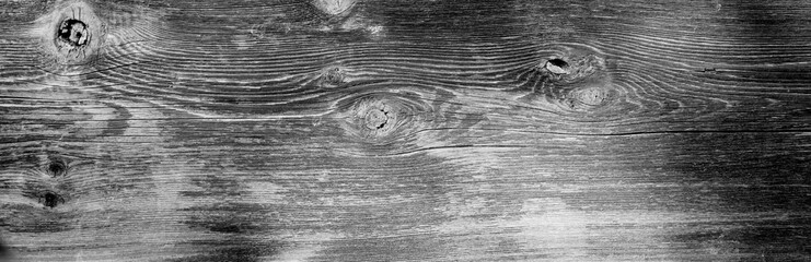 Natural wood grain unfinished wooden board slab with knots and rough texture
