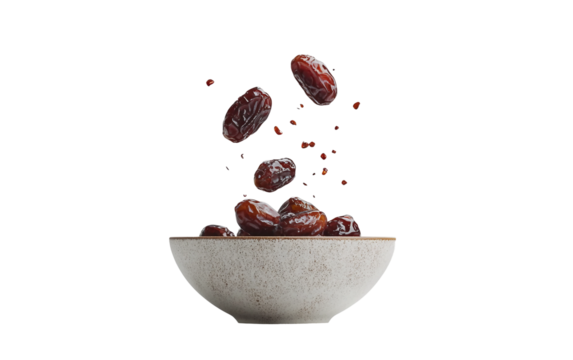 Dates captured in mid air as they fall into a bowl highlighting motion and natural texture isolated on transparent background PNG