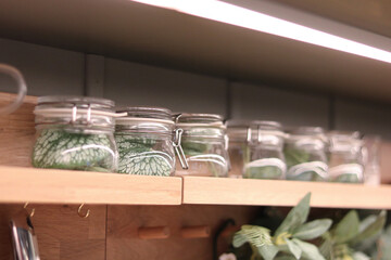Decorative Glass Jars with Green Plants on Wooden Shelf Ikea