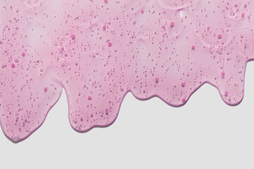 Liquid gel cosmetic smudge berry red microcapsules texture. Beauty skin care product