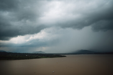 A cloudy day with a storm over a lake surrounded by hills in Mexico. Patzcuaro, Michoacan.