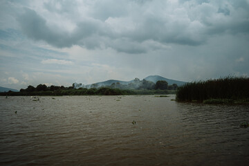 A lake in the mist, with a mystical, mysterious, and nostalgic feel, on a cloudy day in Mexico. Pátzcuaro, Michoacán.