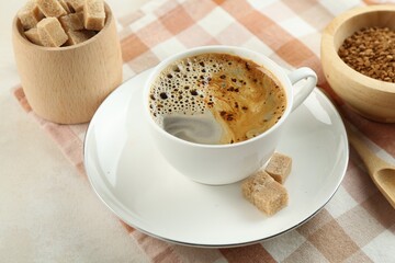 Aromatic instant coffee with sugar on light table, closeup