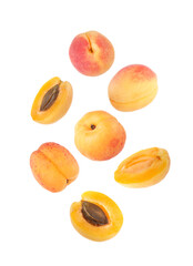 Fresh juicy apricots in air against white background