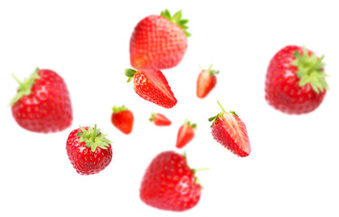 Yummy fresh strawberries swirling in air against white background