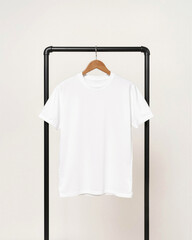 White shirt on a hanger hanging on an industrial clothes rack, front view