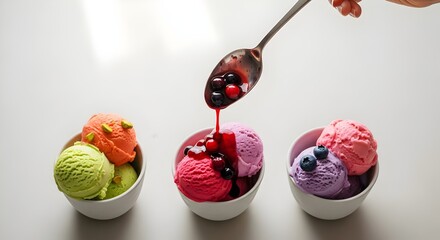 Colorful ice cream scoops in bowls with berry topping and pistachios, a sweet treat