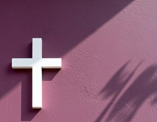 White Cross Sculpture on Textured Deep Plum Wall Christian Symbolism Under Sunlight